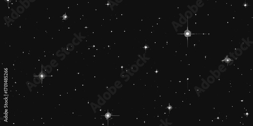 A vast expanse of the night sky filled with twinkling stars and distant galaxies in monochrome tones