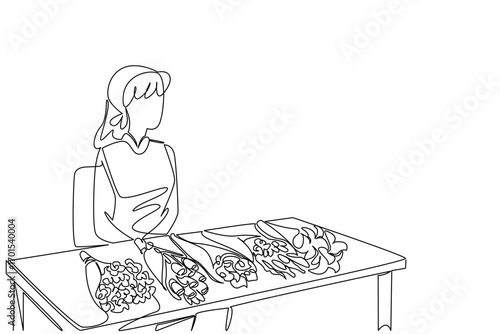 Continuous one line drawing woman sitting and a table with several bouquets of flowers. Waiting for potential buyers to arrive. National Small Business Day. Single line draw design vector illustration