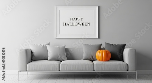 A modern living room decorated for halloween, featuring a gray sofa with pillows, a pumpkin, and a framed happy halloween print wall creating a festive and stylish atmosphere