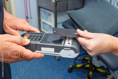 Patient paying for medical healthcare clinic doctor appointment in australia, medicare insurance