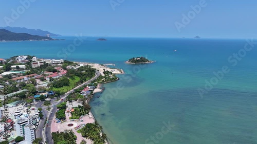 Aerial view of Northern part of Nha Trang city with island in the sea and coastal road, Vietnam.