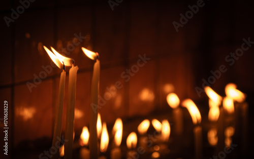 candles lit in the church. Votive Candle Stand.
