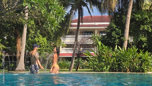 couple in a  swimming pool, resort