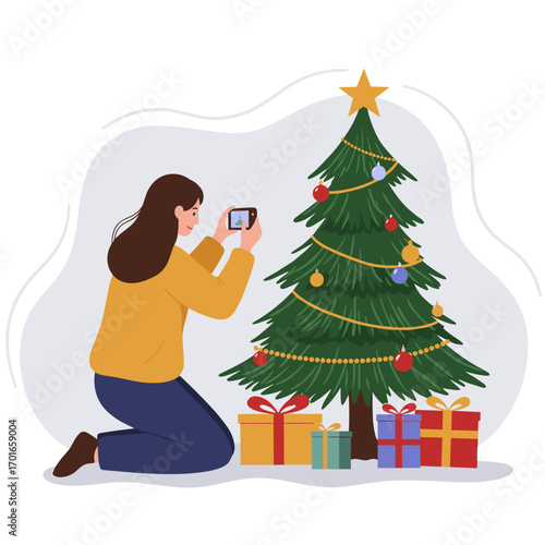 Woman taking photo of Christmas tree and presents at home  