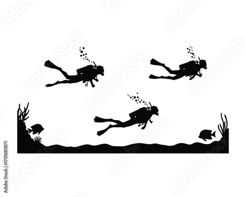 Silhouettes of three scuba divers exploring an underwater world with coral reefs and small fish in clear water