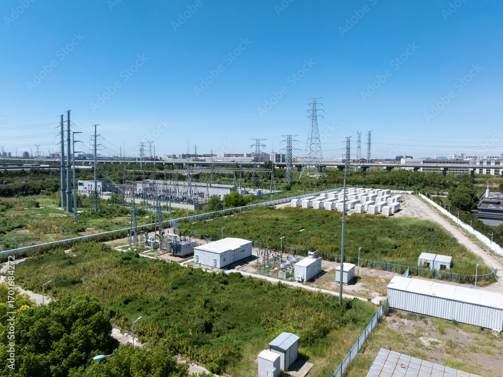 Aerial view of battery energy storage systems under a clear blue sky Aerial view of battery energy storage systems under a clear blue sky