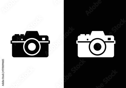 Camera Icon in Black & White: A minimal, clean graphic illustration of a camera icon in contrasting black and white. The image focuses on the simple and universal design of a classic photography tool.
