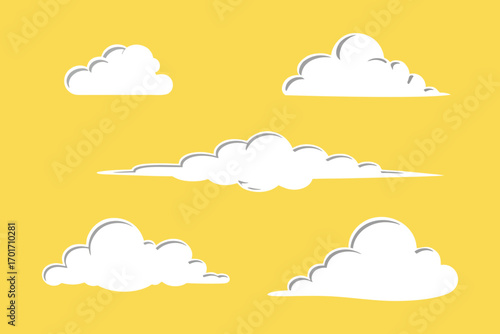 Cartoon clouds floating in a bright yellow sky creating a cheerful atmosphere