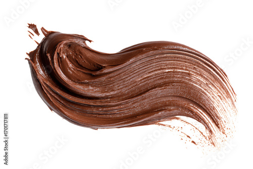 Smear of tasty chocolate pastet on a white background. The brushstroke is long and has a wavy texture