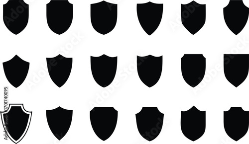 Collection of shield icons in black and white with various decorative edges for design concepts 
