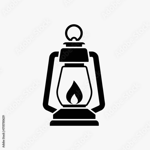 Vector art of black silhouette of an oldfashioned kerosene lantern with a flame, isolated on a, representing light and warmth