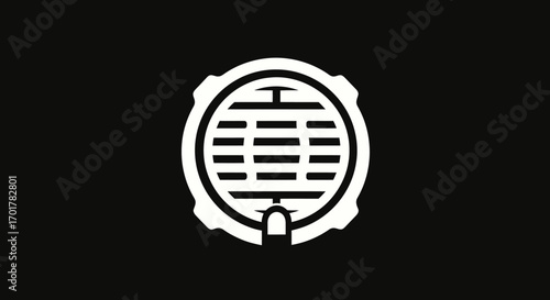 Circular grate with finger pointing downwards.