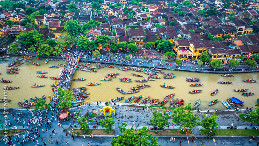 Fototapeta premium Aerial view of Hoi An ancient town, Vietnam at dusk or night, this place is a UNESCO world heritage site. Hoi An is one of the most popular destinations in Vietnam