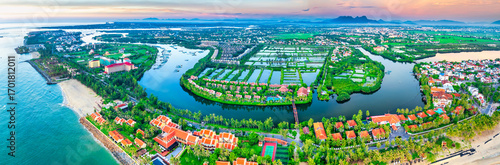 Aerial view of Cua Dai bay in Hoi An ancient town, Vietnam. Agricultural development texture, transport infrastructure and green parks resort
