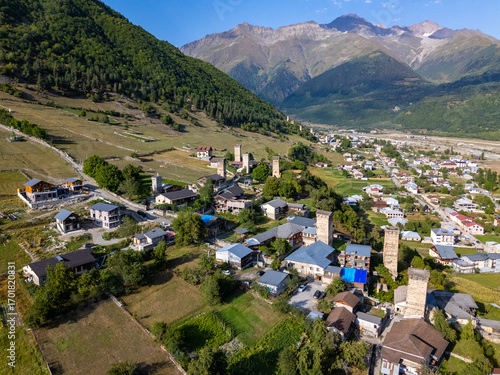 Mestia, Georgia, Ushbis Shesakhvevi street showcasing svan towers and Caucasus mountains