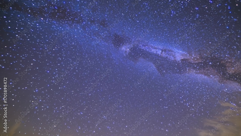 Fototapeta premium Milky is seen in night sky. A galaxy of stars and a blue sky at night. The milky way is a celestial astronomical body that is a part of the universe. The milky way is visible in the night lifestyle.