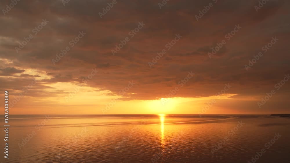 Golden Sunset Over a Calm Sea Golden Sunset Over a Calm Sea