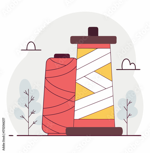 Colorful sewing thread spools with minimalist design and foliage background  