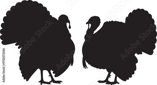 Two black silhouette turkeys facing each other on white background