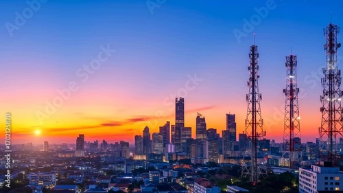 Wallpaper Mural Dynamic time lapse of a metropolitan cityscape with communication towers at golden sunset and twilight transition footage. Torontodigital.ca