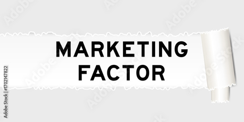 Ripped gray paper background that have word marketing factor under torn part