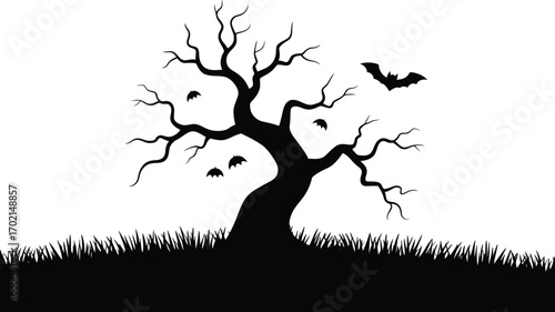 Black silhouette of a bare tree with bats and grass