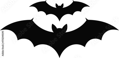 Two black bat silhouettes flying on white background