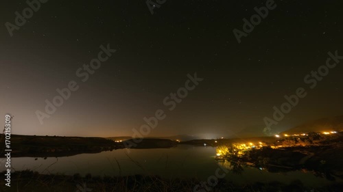 Night time lapse on the lake shore. Sunset and sunrise in timelapse.
