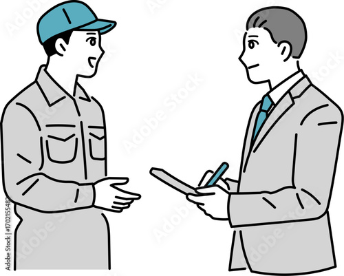 会話をする作業員とスーツの男性