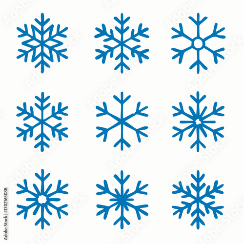 Collection of Symmetrical Blue Snowflakes in Varying Designs on White Background for Winter Holidays
