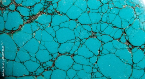 Closeup of turquoise stone with dark irregular veins The surface is cracked