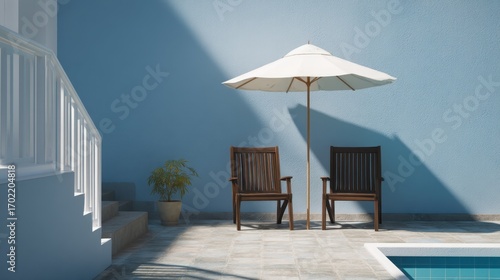 Wallpaper Mural Cozy Outdoor Seating Area with Sun Umbrella by a Poolside in a Relaxing Environment Torontodigital.ca