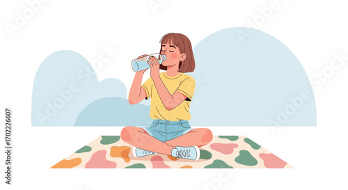 A Young Woman is Drinking Water Outdoors in a Calming Position