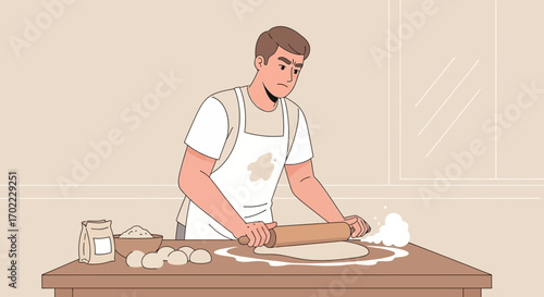 A man wearing an apron rolling dough on a table preparing to bake in the kitchen