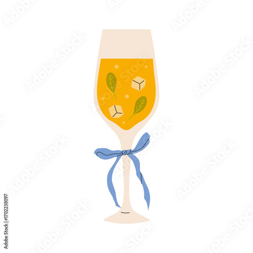 Refreshing beverage in a decorated glass with mint leaves and ice served on a sunny day