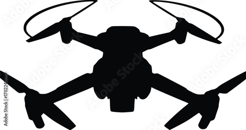 A black silhouette of a drone with its propellers spinning, captured from a front-facing, low-angle perspective against a clean white background.

