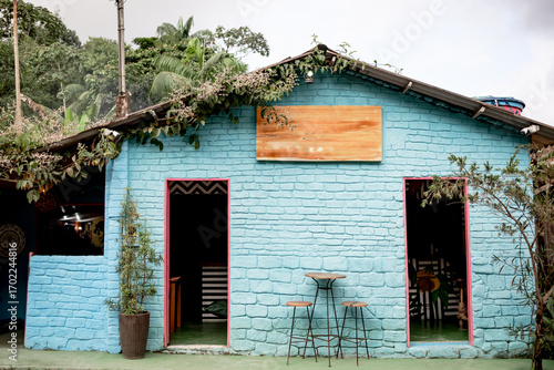 Colorful Rustic Café with Blue Brick Walls and Outdoor Seating