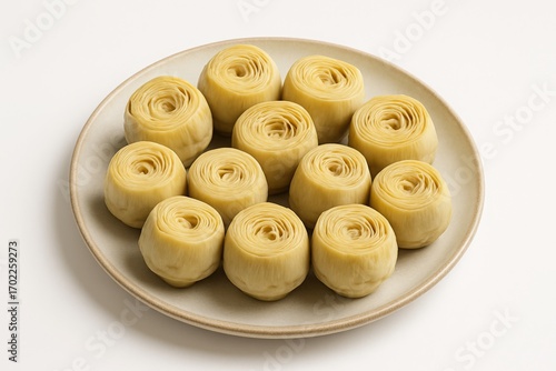 Artichoke hearts on a plate, prepared and ready to eat.