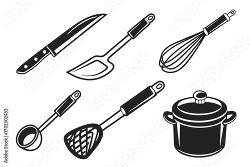 Collection of black and white kitchen utensils and cooking pot
