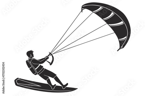 Kitesurfer riding a board with a large kite in the sky