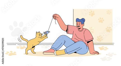 Person playing with a cat using a toy mouse, engaging in indoor activities or hobbies