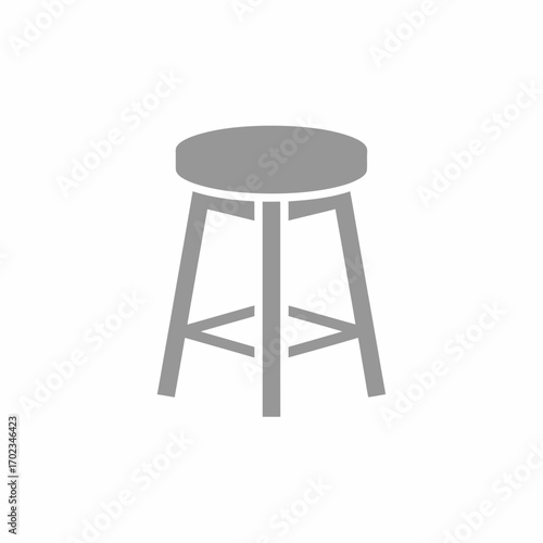 Simple grey silhouette icon of a round-seated stool with three legs on a white background.