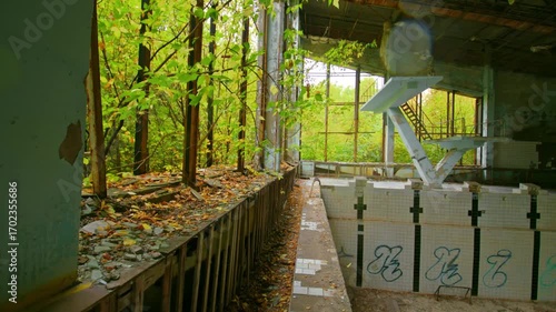Eerie and atmospheric footage captures the decaying beauty of the abandoned Lazurni Swimming Pool in Pripyat, Ukraine, located within the Chernobyl Exclusion Zone.