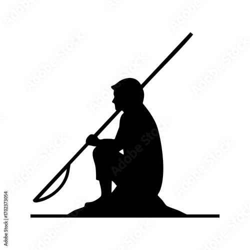 Silhouette of a person crouching with a long-handled fishing net
