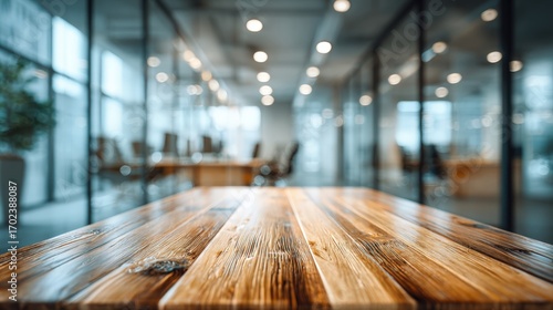 Wallpaper Mural Modern Office Space with Wooden Tabletop in Foreground, Ideal for Product Mockups and Presentation Overlays Torontodigital.ca