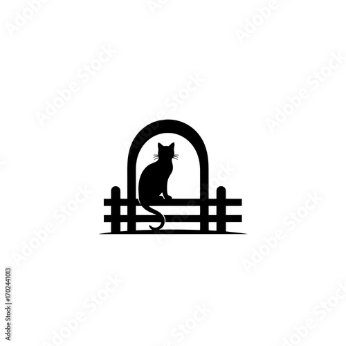 Black cat silhouette sitting on a fence arch isolated on white background
