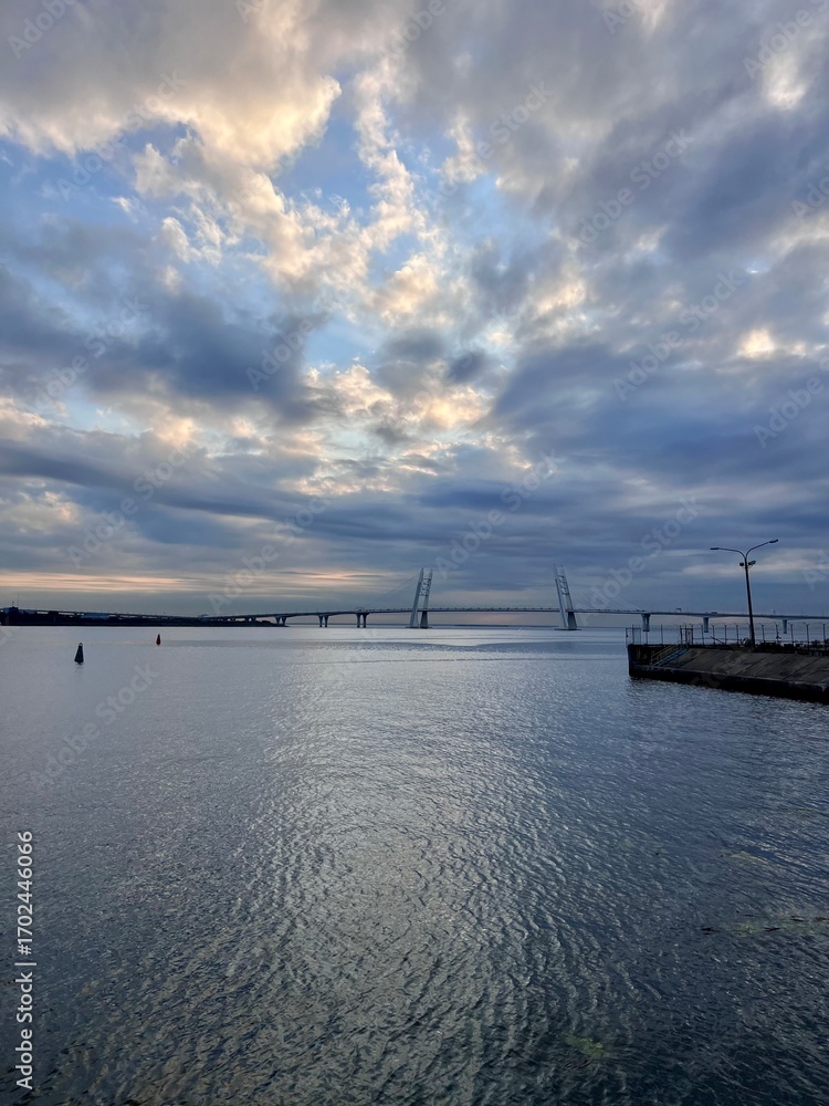 Obraz premium View of the bay with bridges and embankment on a good day vertical lifestyle