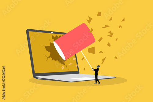 Crazy stressed businessman destroying his desk and laptop with a hammer, concept of job burnout, and pressure