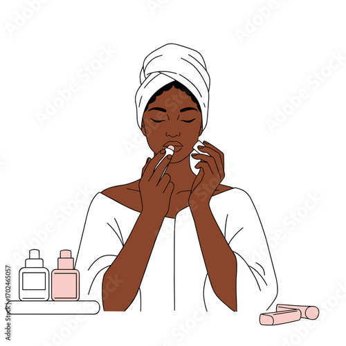 Black woman applying lip balm while enjoying skincare routine  
