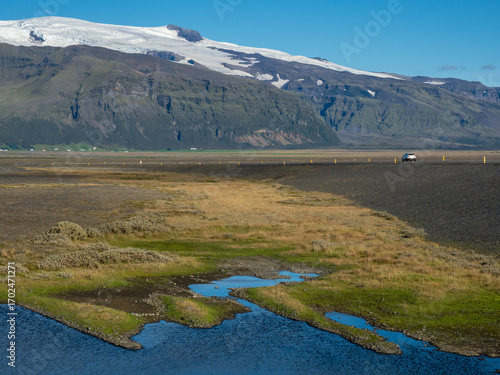 Car driving on the Ring Road in Southern Iceland near Svinafellsjokull glacier